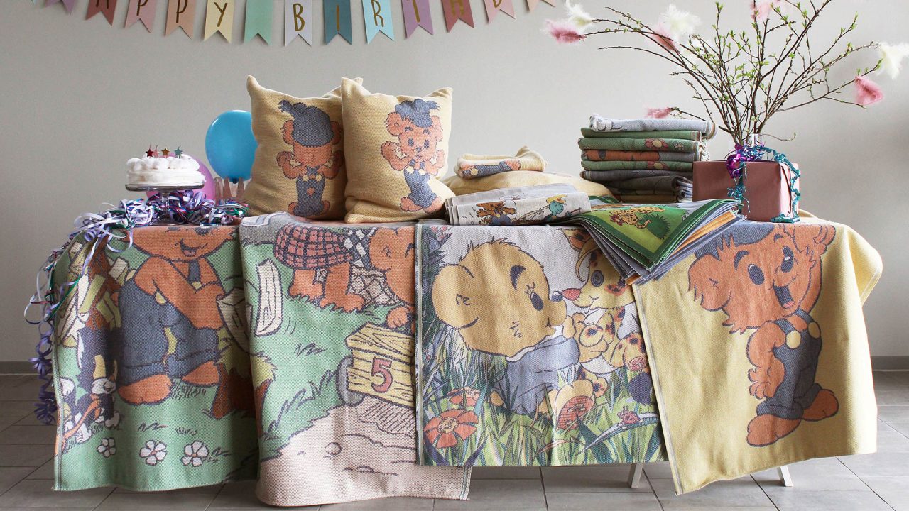 Table with Ekelund Bamse textiles hanging