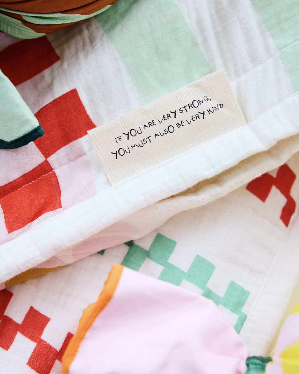 quote embroidered on blanket