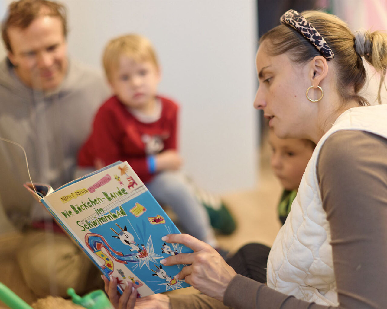Woman reading book for children