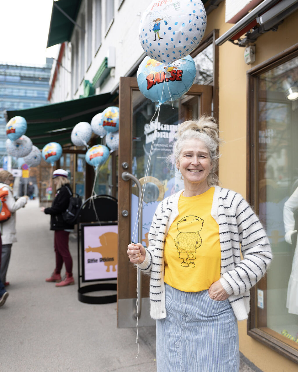 woman holding balloons
