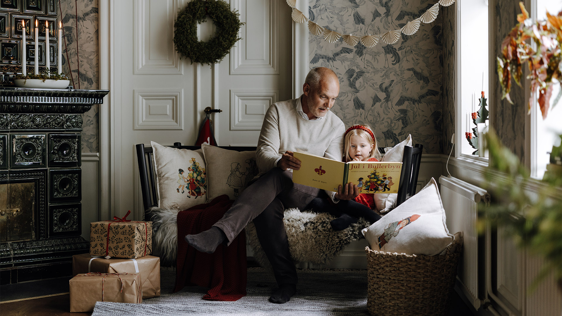 Man reading a book for a child