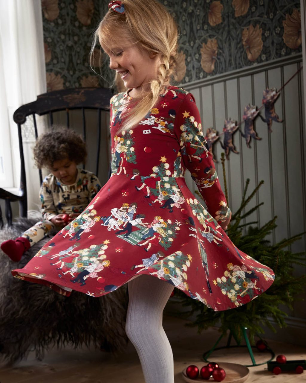 girl wearing red dress with noisy village illustrations